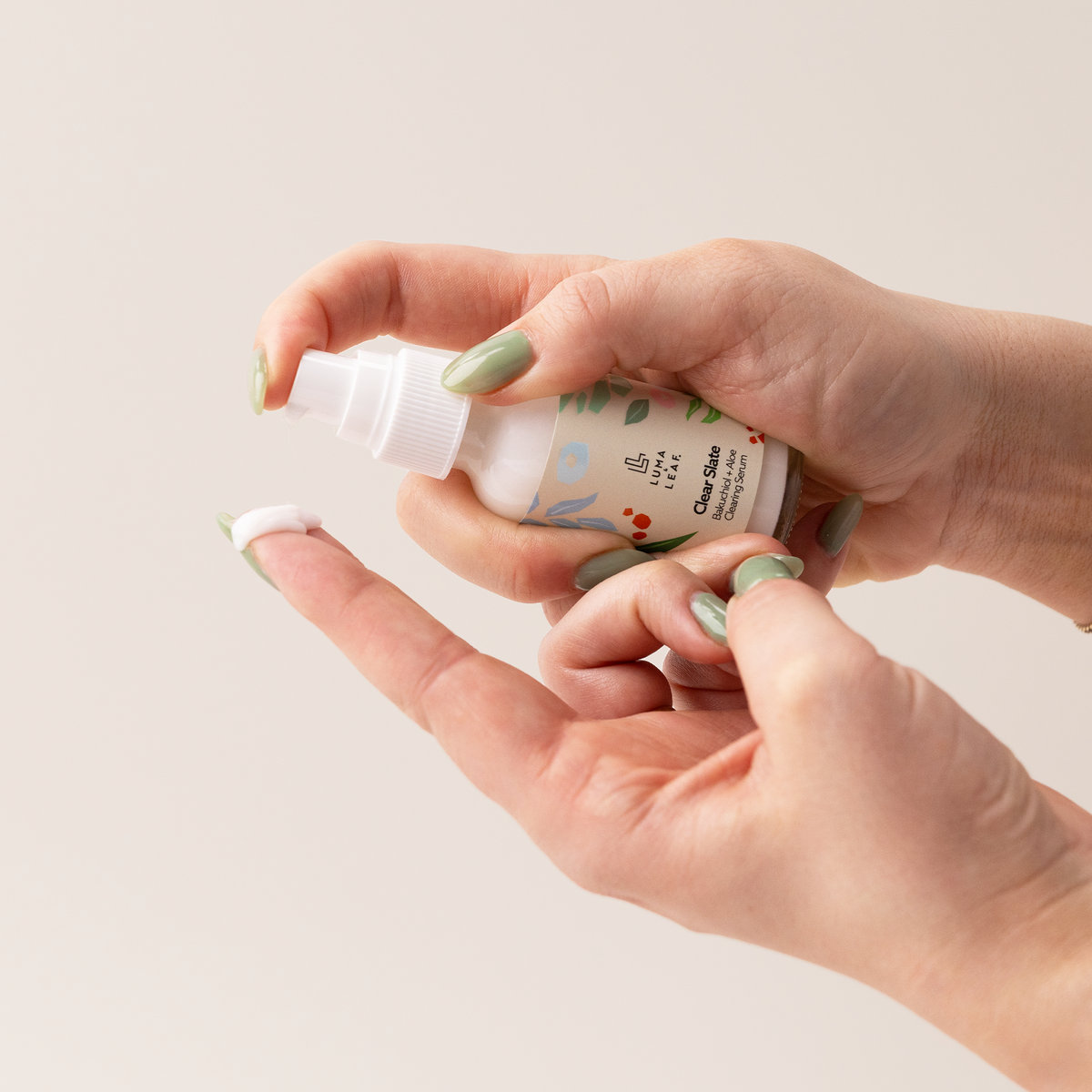 Clear Slate pore clearing serum held in hand to show size