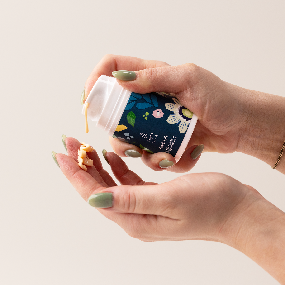 Fresh Lift moisturizer held in hand to show size