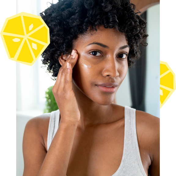 Woman applying a skincare product to her face